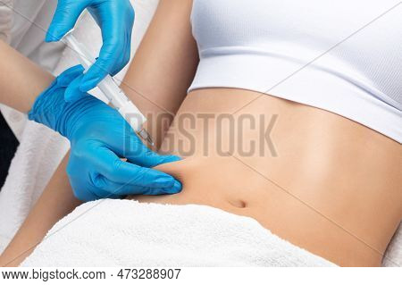 Beautician Makes Lipolytic Injections To Burn Fat On Woman's Belly And Waist. Women's Aesthetic Cosm