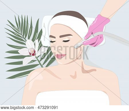 The Cosmetologist Makes The Procedure Microdermabrasion Of The Face Skin Of A Beautiful Girl In A Be