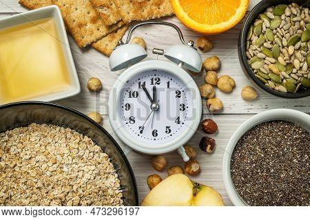 Diet Time. Food Clock. Healthy Eating With Oat Flakes, Hazelnuts, Chia Seeds, Pumpkin Seeds, Sunflow