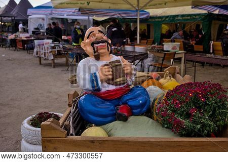Kropyvnytskyi, Ukraine - September 29, 2021: Funny Figure Of A Colorful Character, Pumpkins And Autu