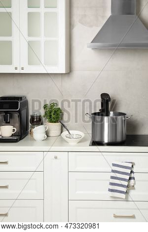 Pot With Sous Vide Cooker In Kitchen. Thermal Immersion Circulator