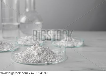 Many Petri Dishes With Calcium Carbonate Powder On White Background. Space For Text