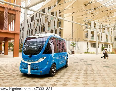 Uae, Abu Dhabi - 13th March, 2023: Autonomous Car Stand In Futuristic City Masdar By Eco-friendly Ar