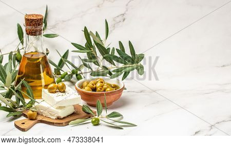 Olive Oil And Olive Berries Olive Tree. On Light Background. Place For Text, Top View,
