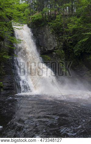 A Waterfall Within Bushkill Falls In Lehman Township Pennsylvania On An Overcast Summer Day.