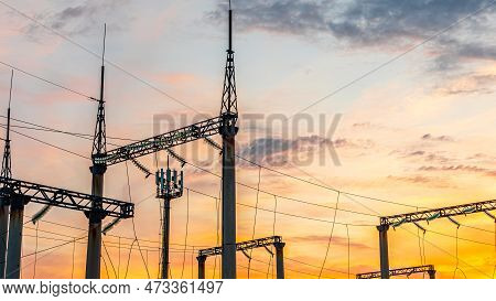 Production Of Fuel And Electricity.electrical Networks With Wires And Transformers At Sunset.power T