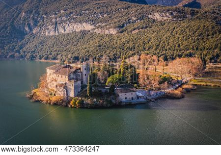 Romantic Toblino Castle On The Shore Of The Beautiful Lake Toblino. Panoramic Aerial View With Lake 