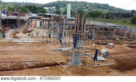 Ilheus, Bahia, Brazil - October 7, 2022: Workers During Construction Of A Polyclinic Of The Estada D