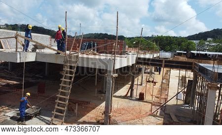 Ilheus, Bahia, Brazil - October 7, 2022: Workers During Construction Of A Polyclinic Of The Estada D