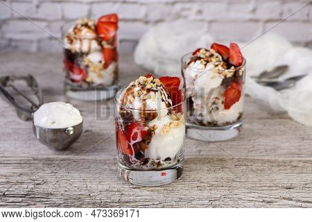 Summer Cold Dessert - Plombir Ice Cream Scoop With Chocolate Sauce, Cookie Crumbs, Ripe Strawberries