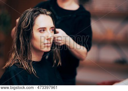 Beautiful Woman Getting Highlights In A Hair Salon