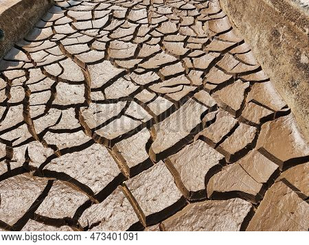 Dry And Cracked Soil Or Sediment Of The Treatment Pond