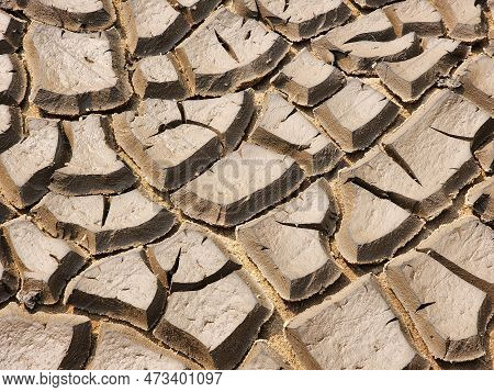Dry And Cracked Soil Or Sediment Of The Treatment Pond