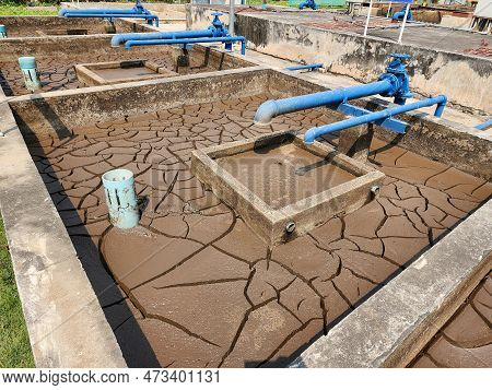 Dry And Cracked Soil Or Sediment Of The Treatment Pond