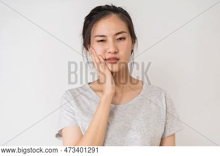 Closing Eyes Asian Young Woman Touching Cheek, Face Expression From Toothache, Tooth Decay Or Sensit