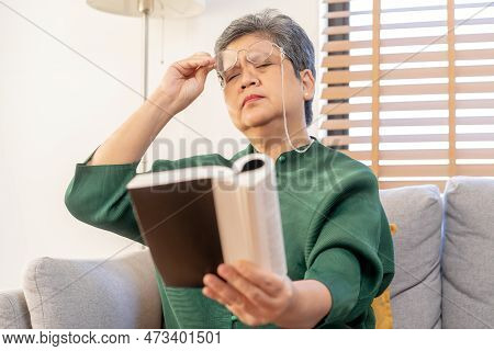 Presbyopia, Hyperopia Mature Asian Woman Holding Eyeglasses Having Problem With Vision Problem Tryin