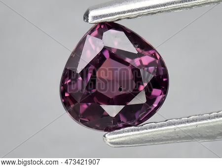 Natural Gem Purple Sapphire On Gray Background