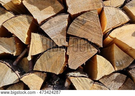 Chopped And Stacked Up Dry Firewood At The Countryside. Stock Pile Of Timber, Chopped Down Trees