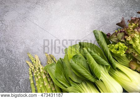 Mockup Assortment Of Fresh Organic Home Grown Green Vegetables On Gray Granite Table. Asparagus Plan