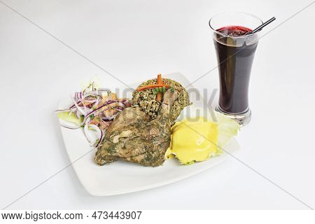 Ration Of Chicken Thigh Cooked With Peruvian Recipe With Chaufa Rice And Potato Garnish With Chili P