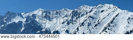 Panoramic View Of The Mountains Near Shymbulak Ski Resort. Snow Mountains. Ile-alatau National Park.