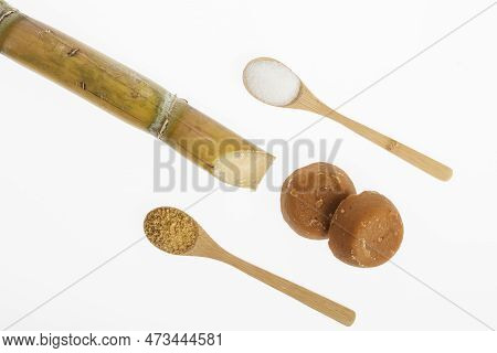 White Sugar, Brown Sugar And Sugar Cane Panela On White Background