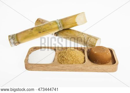 White Sugar, Brown Sugar And Sugar Cane Panela On White Background