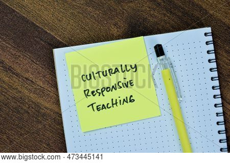 Concept Of Culturally Responsive Teaching Write On Sticky Notes Isolated On Wooden Table.
