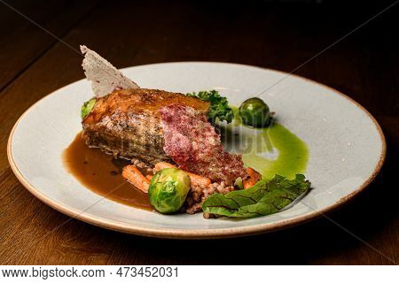 Great View On Dish Of Piece Of Baked Meat With Buckwheat And Vegetables On Plate
