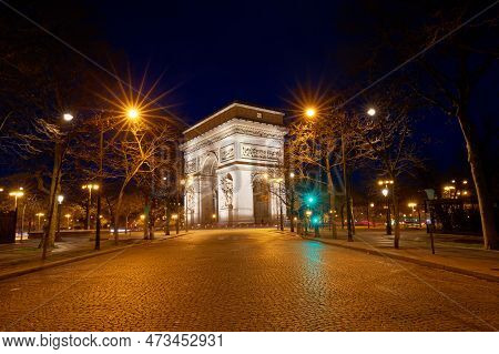 The Triumphal Arch In Rainy Evening, Paris, France.