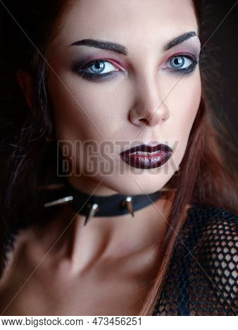Close-up Portrait Of The Beautiful Young Goth Girl. Dark Beauty