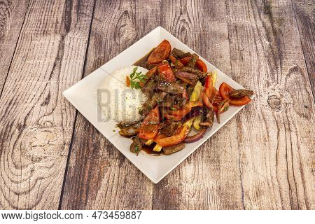 Fantastic Traditional Peruvian Lomo Saltado Recipe With Portion Of White Rice, Pieces Of Tenderloin,