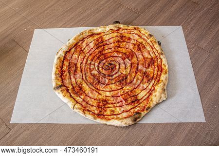 Thin Crust Pizza With Bacon And Barbecue Sauce Recipe On White Greaseproof Paper