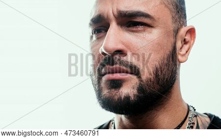 Feeling Sad And Crying. Sad Man. Unhappy Hispanic Man With Tears On Sad Face. Suffering Handsome Lat