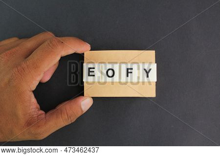 Hand Holding A Piece Of Paper With The Letters Eofy Or The Word End Of Financial Year