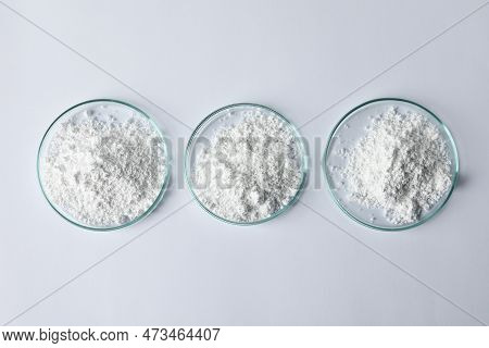 Petri Dishes With Calcium Carbonate Powder On White Table, Flat Lay