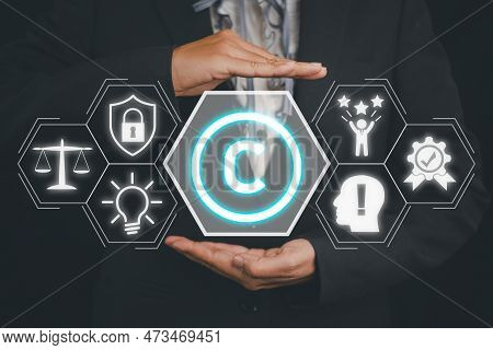 Copyright Or Patent Concept, Person Hand Holding Copyright Icon On Virtual Screen Background, Copyle