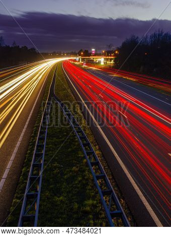 Oldenzaal, Netherlands - March 24, 2023: Long Exposure Shot Of Traffic On The E30 Highway From Amste