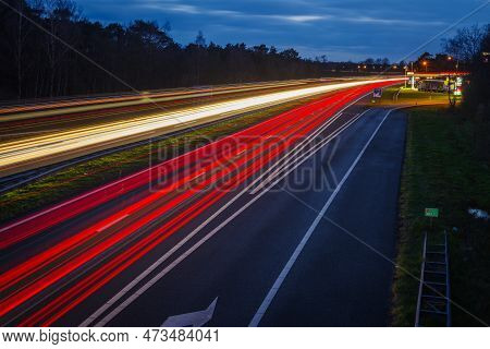 Oldenzaal, Netherlands - March 24, 2023: Long Exposure Shot Of Traffic On The E30 Highway From Amste