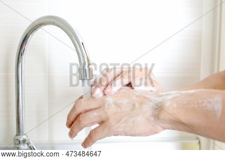 Hand Of Beauty Woman  Wash Your Hands At The Wash Basin With Foam, Cleanse The Skin And Have Water F
