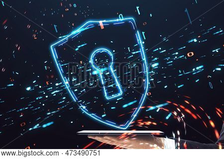 Close Up Of Hand Using Mobile Phone With Glowing Safety Shield Icon On Blurry Dark Background. Secur