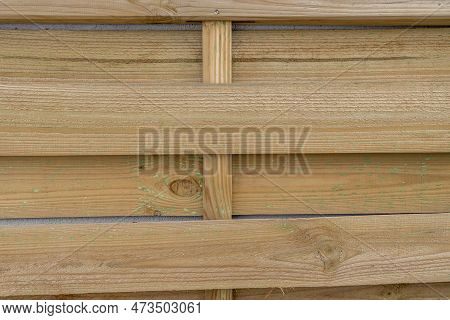 Unvarnished Slats Of A Wooden Latticework For Outdoor Use On An Urban Terrace.