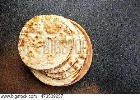 Pita Bread On A Wooden Board. Traditional Arabic Cuisine. Banner, Menu, Recipe Place For Text, Top V