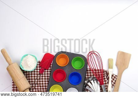 Top View Set Of Kitchen Utensils And Ingredients For Bakery On White Background. Materials Or Kitche