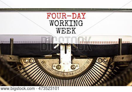 Four-day Working Week Symbol. Concept Words Four-day Working Week On White Paper Typed On Old Retro 