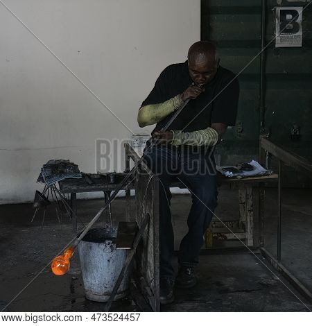 Arusha, Tanzania - October 17th, 2022: A Participant In The Shanga Project For Disabled People, Blow