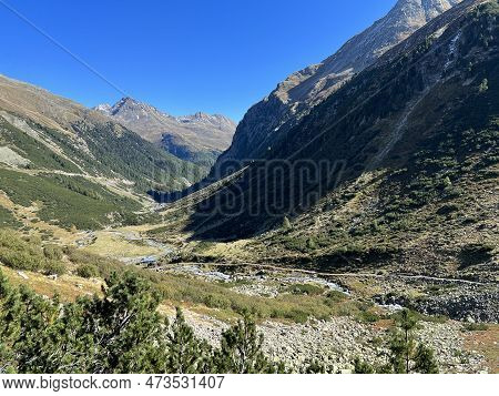 Beautiful Autumn Panorama Of The Alpine Valley Val Grialetsch And The Stream Aua Da Grialetsch In Th