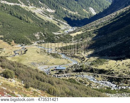 Beautiful Autumn Panorama Of The Alpine Valley Val Grialetsch And The Stream Aua Da Grialetsch In Th