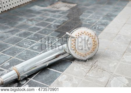 Silver Shower Head With Limescales. Shower Damaged From Water Scale. Hard Water Deposit All Around T