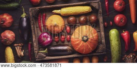 Close-up Of Fresh Fruits And Vegetables In A Box On A Flatline Wooden Table. Assorted Autumn Harvest